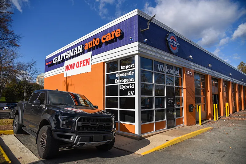 Craftsman Auto Care storefront with black truck.